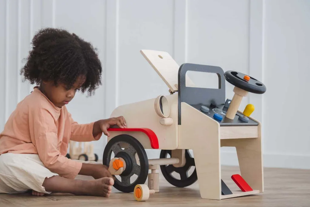 Plan Toys Spielzeug Automechaniker/Fahrsimulator Holz
